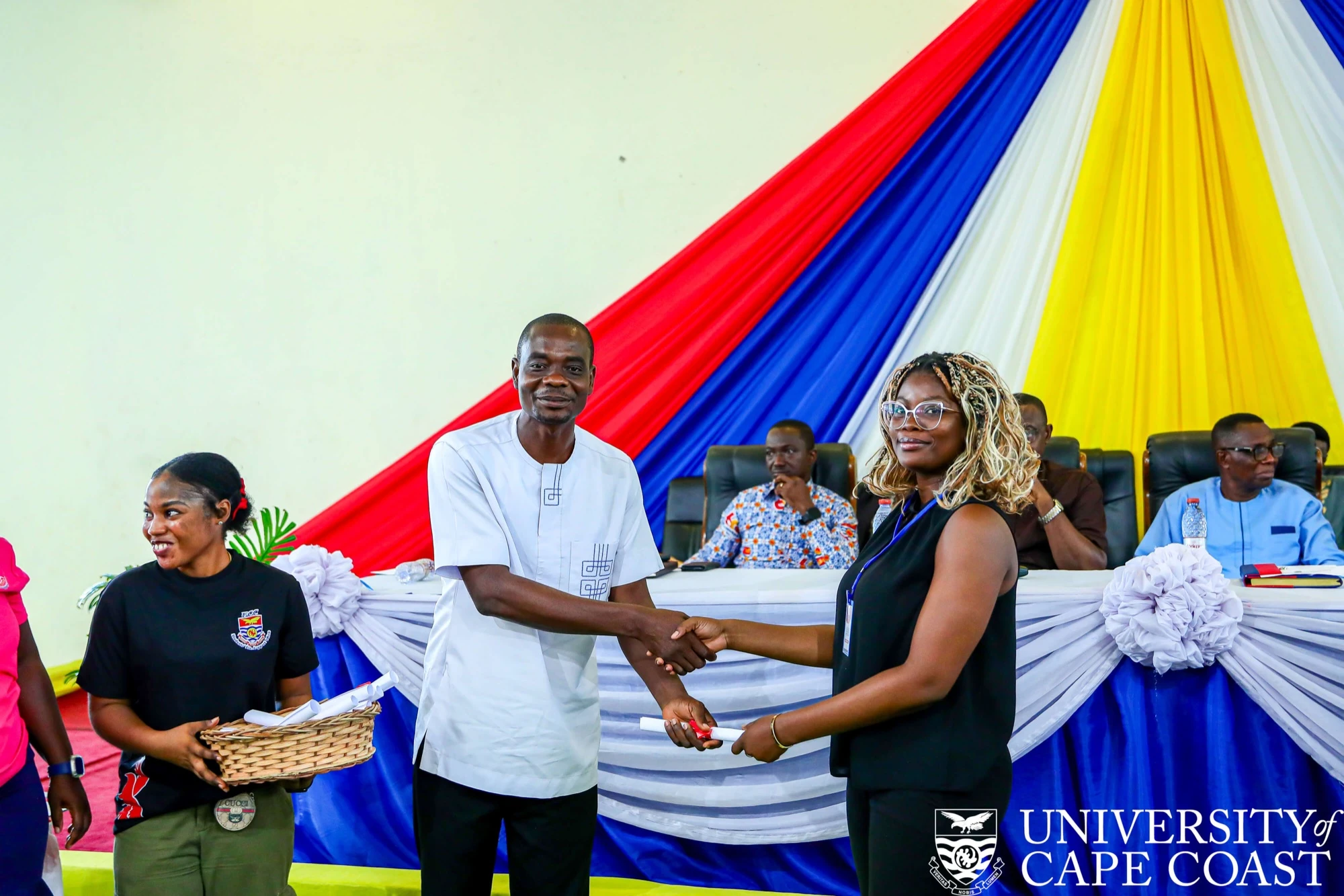 An awardee receives their certificate