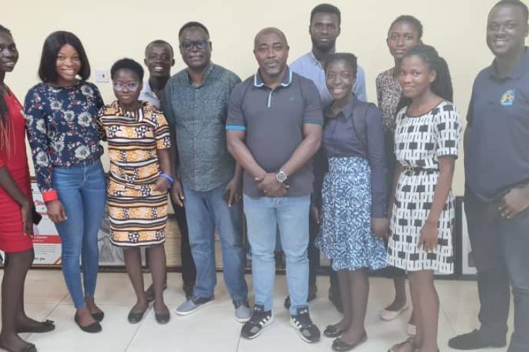 The Dean of Students at UCC  is photographed alongside the recipients of the Peacan Scholarship, along with several members of the Student Financial Support Office (STUFSO).